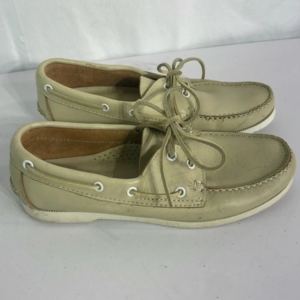 Minnetonka cream leather boat shoes, white sole